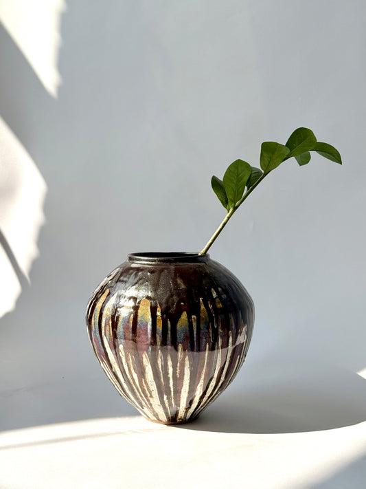 hand-thrown black drip glaze stoneware vessel